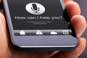 Person Using Voice Recognition Function On Mobile Phone - SEO in 2020