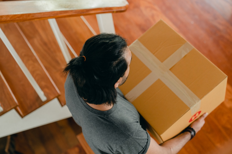 Man Carrying A Box