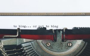 to blog or not to blog written on a paper using typewriter